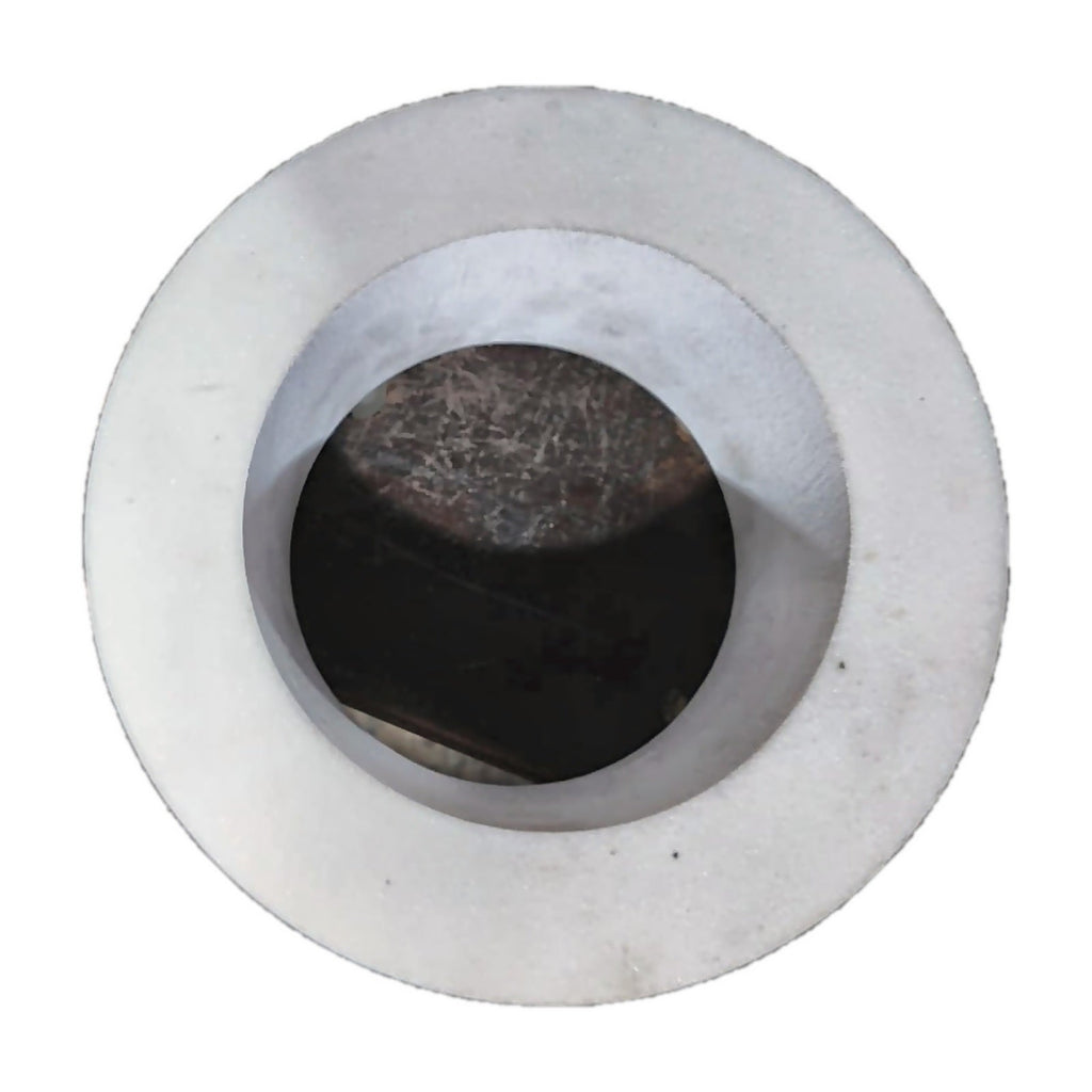 White grinding stone wheel, face view showing the bore